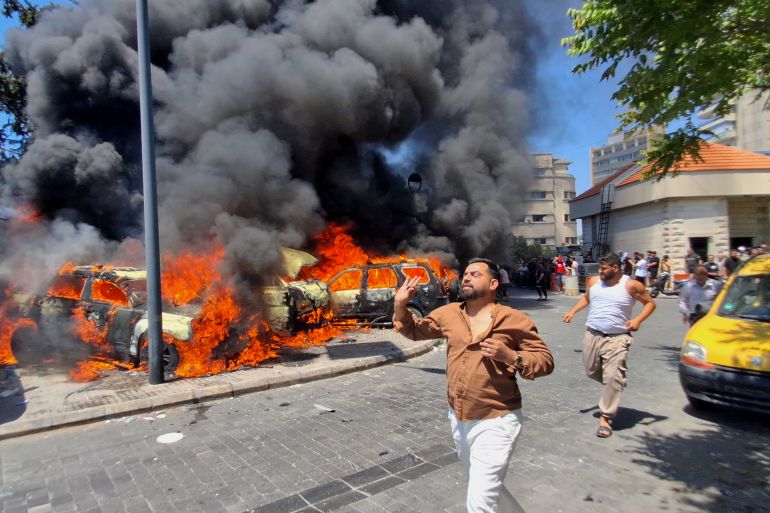 ap_6a29bf44a0295-1781120836 People run in front of burned cars that were attacked in an Israeli airstrike in the southern port city of Sidon, Lebanon, Wednesday, June 10, 2026. (AP Photo/Mohammed Zaatari)