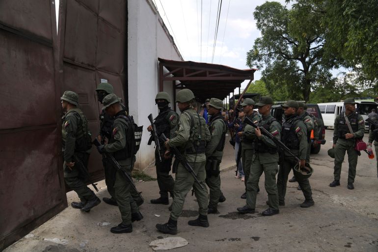 ap_6a2cb9f5c1ae7-1781316085 FILE - Soldiers raid the Tocorón Penitentiary Center, where the Tren de Aragua gang originated, in Tocorón, Venezuela, Sept. 20, 2023. (AP Photo/Ariana Cubillos, File)