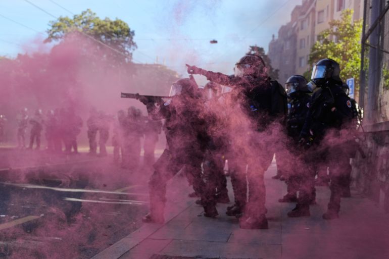 ap_6a2f9e1c76708-1781505564 Police respond during a "No G7" demonstration in Geneva, Switzerland, Sunday, June 14, 2026, ahead of the G7 summit scheduled to take place June 15-17. (AP Photo/Baz Ratner)