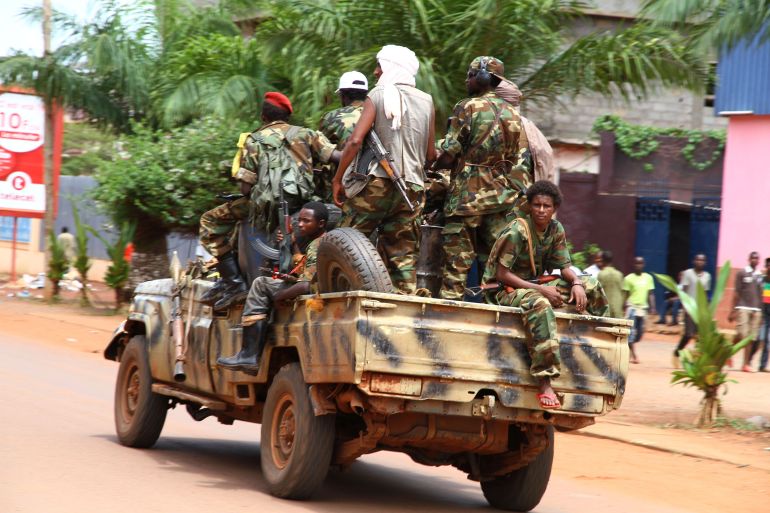ap_6a3244a3aaa00-1781679267 Rebel soldiers drive through the center of the capital Bangui in Central African Republic, Tuesday, March 26, 2013. Michel Djotodia, one of the leaders of the Seleka rebel coalition whose fighters seized the capital of Central African Republic over the weekend, announced late Monday that he has dissolved the country's constitution and will stay in power for three years, according to excerpts from the broadcast carried on French radio. Djotodia justified his coup d'etat, saying ousted President Francois Bozize had veered into dictatorship during his 10 years in power.(AP Photo)