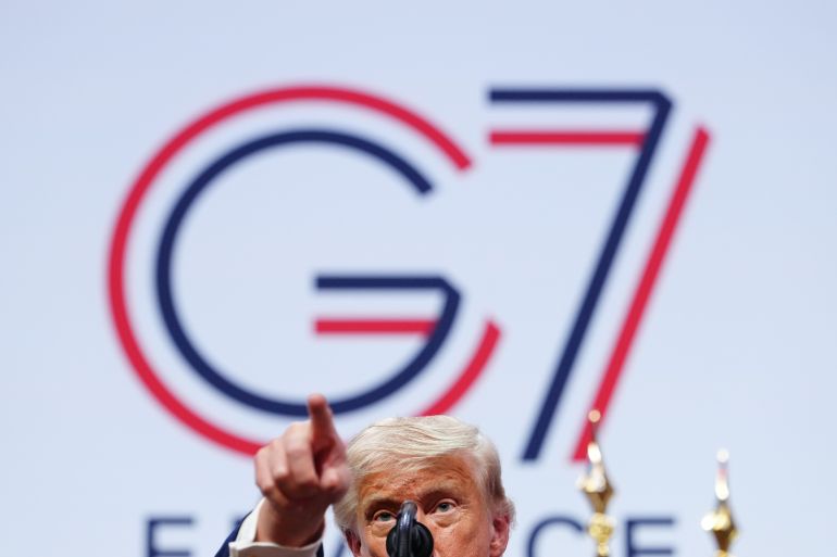 ap_6a33e1409e2c6-1781784896 U.S. President Donald Trump points his finger during a news conference at the G7 summit, Wednesday, June 17, 2026, in Evian-les-Bains, France. (AP Photo/Julia Demaree Nikhinson)