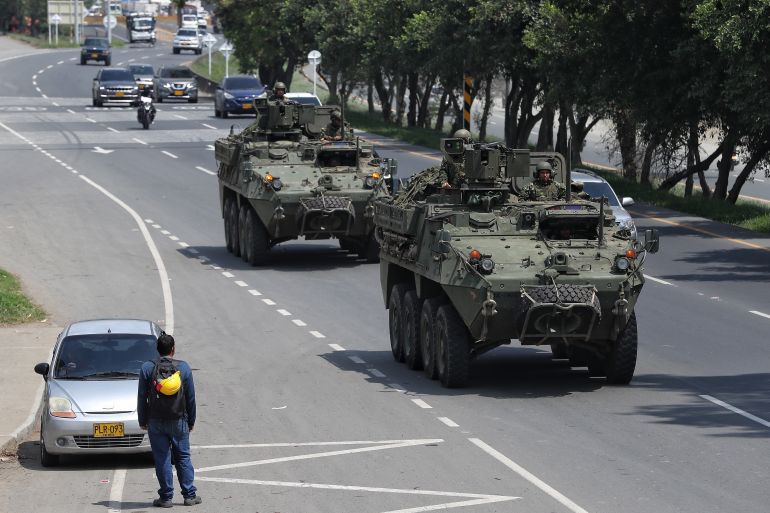 ap_6a3736f47ff1b-1782003444 Soldiers patrol the streets of Cali, Colombia, Saturday, June 20, 2026, as security is heightened a day ahead of the presidential runoff election. (AP Photo/Santiago Saldarriaga)