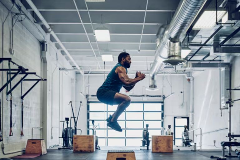 asdf-1781516774 An athletic man cross training in a gym.
