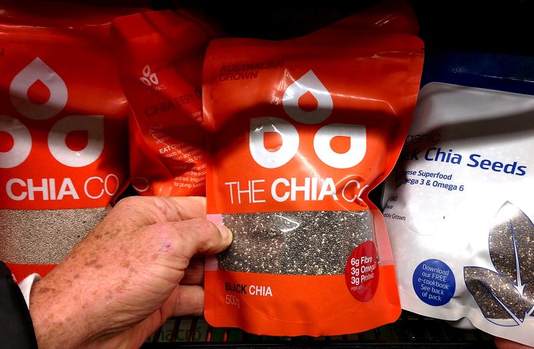 bdhwr-alshya-1780754650 A customer holds chia seeds from the Chia Co company, owned by Australian farmer John Foss, at a suburban supermarket in Sydney, Australia, July 7, 2015. While Australia's main agricultural products like wheat, rice, sugar and beef have traditionally fed Asia, there is now a wave of farmers moving to premium crops as Australia pushes to become Asia's delicatessen. After being fed up with being subjected to the market volatility that had long plagued his Australian family wheat farm, John Foss abandoned tradition and took a risk on a little known crop. His decision to ditch wheat in favour of chia seeds in 2003 left his family bemused. More than a decade on, Foss is the one smiling. Demand for chia is soaring and Foss, now overseeing the global expansion of his Chia Co business from a New York office, has little trouble selling the crop's prospects to other growers. Picture taken July 7, 2015. To match AUSTRALIA-AGRICULTURE/DELICATESSEN REUTERS/David Gray