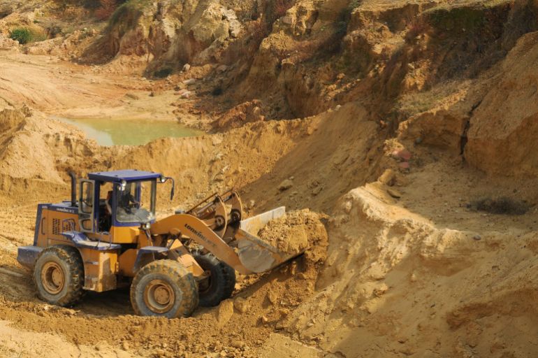 china34-1761235979 A worker drives a skip loader while working at the site of a rare earth metals mine at Nancheng county, Jiangxi province October 31, 2010. China told the United States on Saturday it would not withhold rare earth minerals but the two nations did not appear to make headway on disputes over North Korea and regional territorial claims. REUTERS/Stringer (CHINA - Tags: ENERGY ENVIRONMENT BUSINESS) CHINA OUT. NO COMMERCIAL OR EDITORIAL SALES IN CHINA
