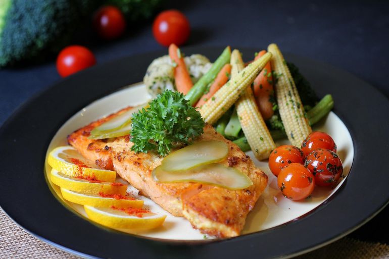 Fried Fish and Vegetables on Ceramic Plate