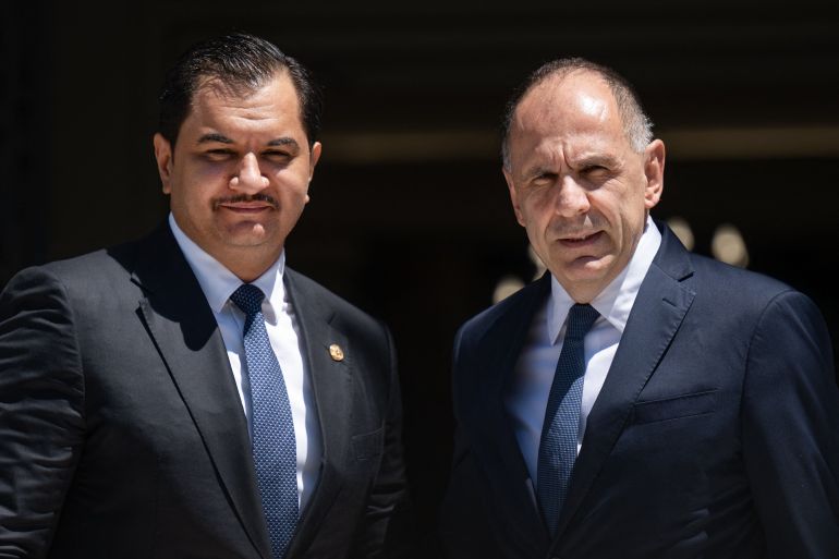 doc-b74b8wg-1781721969 Greece's Foreign Minister Giorgos Gerapetritis (R) welcomes Deputy Commander of the Libyan National Army, Lieutenant General Saddam Haftar prior to their meeting in Athens on June 15, 2026. (Photo by Angelos TZORTZINIS / AFP) (الفرنسية)
