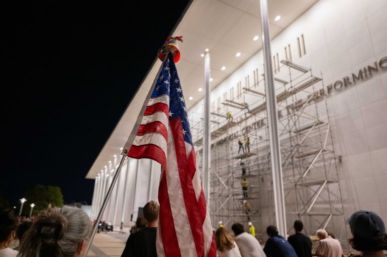 epa_6a2df4476d6c-1781396551 epa13033924 Workers remove the name of US President Donald J. Trump from the facade of the John F. Kennedy Center for the Performing Arts in Washington, DC, USA, 12 June 2026. The removal comes after a federal judge ruled that the name had been added illegally. EPA/MATT KAMINSKY