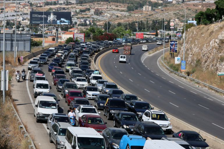 epa_6a305c06e109-1781554183 epa13039576 Vehicles line up on the Rmeileh highway as displaced Lebanese return to their villages in southern Lebanon, 15 June 2026, after the announcement of a US-Iran mediated preliminary framework to end regional military hostilities and lift the naval blockade on the Strait of Hormuz. EPA/WAEL HAMZEH