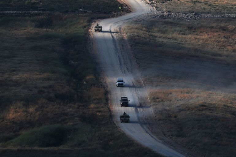 epa_6a38e6be0758-1782113982 epa13054642 Israeli military vehicles maneuver on the Lebanese side of the Israel-Lebanon border, as seen from the Upper Galilee, in northern Israel, 21 June 2026. Israel and Hezbollah agreed to a new ceasefire on 19 June 2026, after a flare-up nearly derailed peace talks in the region. EPA/ATEF SAFADI