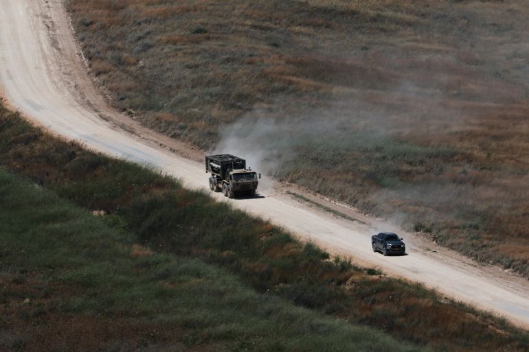 epa13064281 An Israeli military vehicle maneuvers on the Lebanese side of the border, as seen from Israeli side of the border in the Upper Galilee, northern Israel, 25 June 2026, amid a ceasefire between Israel and Hezbollah. EPA/ATEF SAFADI