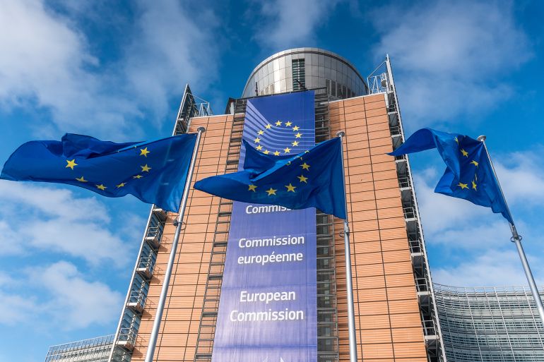 fgh6657876-1780935720 European Union flags waiving in front of Berlaymont building of the European Commission, Brussels, Belgium