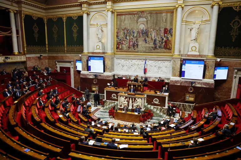 A general view shows the hemicycle during a debate and before votes on two no-confidence motions against the French government, one tabled by members of parliament of La France Insoumise (France Unbowed - LFI) allied with the Greens and the Communists, and an other one tabled by the Rassemblement National (National Rally - RN) and the UDR (the Union des Droites), after the use by French government of the article 49.3, a special clause in the French Constitution, to push the first part of the budget bill for 2026 (PLF 2026) through the National Assembly without a vote by lawmakers, at the National Assembly in Paris, France, January 23, 2026. REUTERS/Gonzalo Fuentes