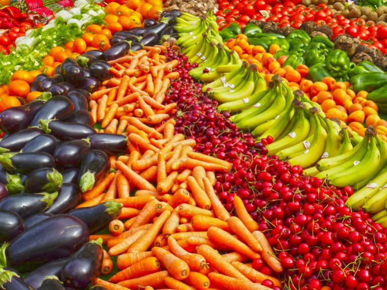 fwakh-1779695204 Vibrant selection of fresh fruits and vegetables on a market stall. Healthy eating and organic living.