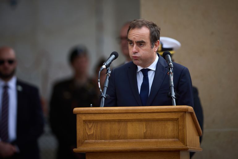 getty_68ed22f54c-1760371445 COLLEVILLE-SUR-MER, FRANCE - JUNE 06: France's Minister of Armed Forces Sebastien Lecornu reacts as he speaks during a ceremony at the Normandy American Cemetery to mark the 81st anniversary of the D-Day landings during World War II on June 06, 2025 in Colleville-sur-Mer, France. Today marks the 81st Anniversary of 'Operation Overlord', the Allied invasion of Normandy during World War II that led to the liberation of Western Europe and eventual defeat of Nazi Germany. (Photo by Kiran Ridley/Getty Images)