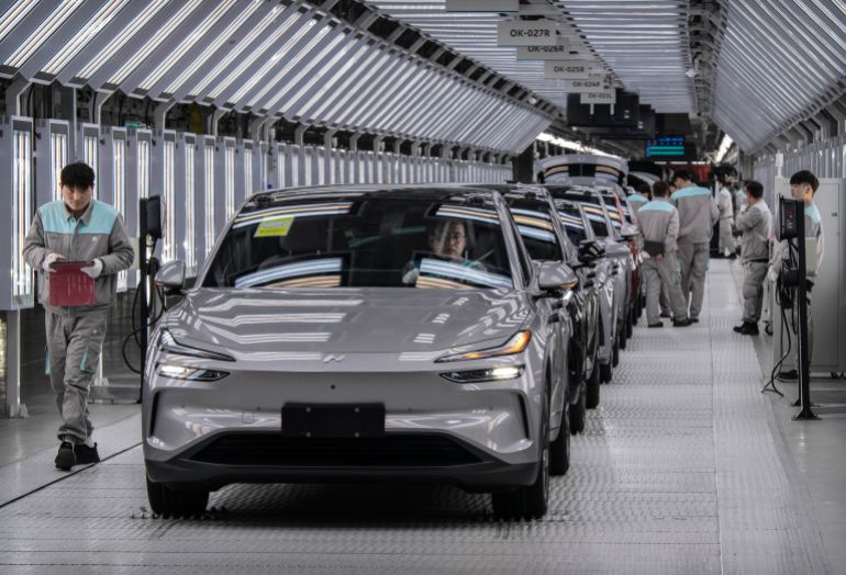getty_69737d79aa-1769176441 HEFEI, CHINA - JANUARY 17: Workers from Chinese electric vehicle (EV) company NIO inspect vehicles in the final quality control area on the automated production line at the companys manufacturing hub on January 17, 2025 in Hefei, China. China produces and exports more electric vehicles than any other country, leading the global electric vehicle (EV) market with production capacity that now outpaces domestic sales. Luxury brand NIO saw a 38% rise in EV deliveries in 2024 and is looking to further its expansion into overseas markets with a range of premium vehicles, a new lower priced sub-brand, and its battery swapping charging system. Exports of Chinese EVs exceeded two million for the first time in 2024, according to government figures. While the global expansion of Chinas EV industry has triggered trade tensions with the U.S. and Europe where governments are enacting tariffs on China-made electric cars, the companies are making inroads in markets in Asia, South America, and Africa. Chinese brands have become known worldwide for design and advanced EV technology at competitive prices, as they continue to fuel a transition to electric vehicles at home in the worlds largest car market. (Photo by Kevin Frayer/Getty Images)