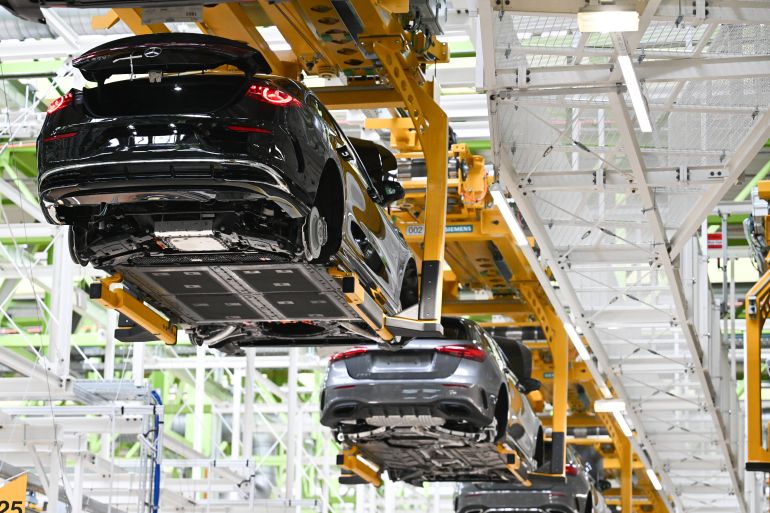 RASTATT, GERMANY - JUNE 4: Fully electric and hybrid versions of the new Mercedes-Benz CLA sedan pass by on a conveyor at the Mercedes-Benz assembly plant on June 4, 2025 in Rastatt, Germany. Negotiations between American and European Union representatives over tariffs are continuing. The German automotive industry, which exports heavily to the USA, is especially exposed to any punitive tariffs of the Trump administration. (Photo by Florian Wiegand/Getty Images)