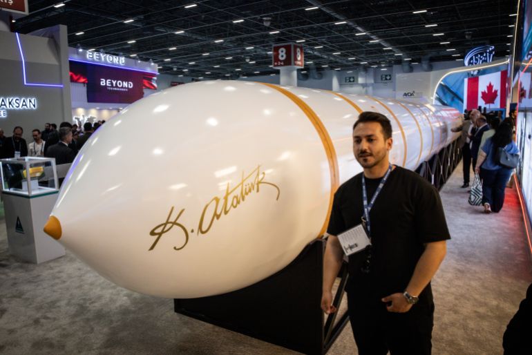 ISTANBUL, TURKEY - MAY 06: A man poses for a photograph in front of the newly unveiled, Turkish made intercontinental ballistic missile Yildirimhan at the SAHA International Defence and Aerospace Expo on May 06, 2026 in Istanbul, Turkey. The International Defence and Aerospace Exhibition, showcased Turkish and foreign companies new products and technology. The expo was dominated by UAV products as modern warfare increasingly shifts to drone and unmanned technologies. (Photo by Chris McGrath/Getty Images)