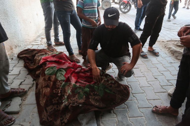 GAZA CITY, GAZA - MAY 31: (EDITORS NOTE: Image depicts death) The body of a young man lies at Al-Shifa Hospital after he was killed in an Israeli airstrike in Gaza's port on May 31, 2026 in Gaza City, Gaza. An IDF strike that targeted the Port of Gaza on Sunday has left at least two dead and 25 injured, according to initial reports. The Hamas-run Gaza Media Office says more than 900 Palestinians have been killed and thousands more injured in Israel's repeated violations of the tenuous US-brokered ceasefire agreed in October last year.  (Photo by Ahmad Hasaballah/Getty Images)