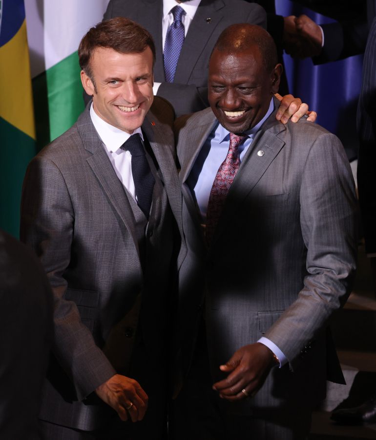 getty_6a25152c54-1780815148 BERLIN, GERMANY - NOVEMBER 20: French President Emmanuel Macron (L) and William Ruto, President of Kenya, share a laugh at the G20 Compact With Africa conference on November 20, 2023 in Berlin, Germany. Compact With Africa is a German initiative to encourage investment in participating African countries. (Photo by Sean Gallup/Getty Images)