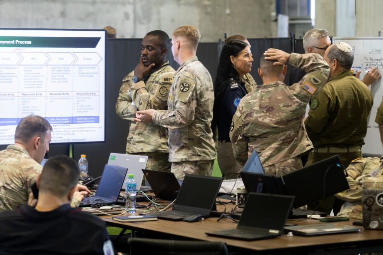 getty_6a253db302-1780825523 KIRYAT GAT, ISRAEL - NOVEMBER 20: U.S. Army personnel, IDF personnel and others international officials seen at a group meeting during a media tour inside the Civil-Military Coordination Center (CMCC) on November 20, 2025 in Kiryat Gat, Israel. The American-led military facility 13 miles north of the Gaza Strip is where U.S. and Israeli soldiers, along with foreign diplomats and NGO representatives, are monitoring the ceasefire in Gaza and discussing the future of the Palestinian territory. Critics have noted the lack of formal Palestinian representation in the CMCC. (Photo by Amir Levy/Getty Images)