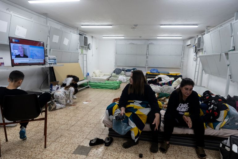 getty_6a25cf3a9f-1780862778 KIRYAT SHEMONA, ISRAEL, - APRIL 9: Women and children find cover in a bomb shelter on April 9, 2026 in Kiryat Shemona, Israel. Iran has continued firing waves of drones and missiles at Israel after the United States and Israel launched a joint attack on Iran early on February 28th. (Photo by Amir Levy/Getty Images)