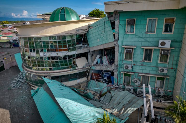 getty_6a2809d7c9-1781008855 GENERAL SANTOS, PHILIPPINES - JUNE 09: An aerial view shows a collapsed building of the Notre Dame of Dadiangas University following a magnitude 7.8 earthquake on June 09, 2026 in General Santos, Sarangani province, Philippines. A magnitude 7.8 earthquake struck off Mindanao on June 8, killing at least 37 people, injuring more than 200 and damaging buildings across parts of the southern Philippines, as authorities continued rescue and relief operations. (Photo by Ezra Acayan/Getty Images)