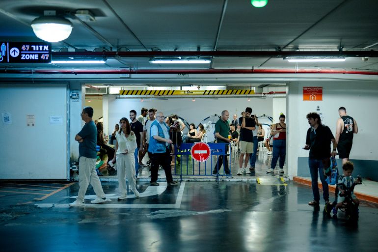 getty_6a2a4f0947-1781157641 TEL AVIV, ISRAEL - JUNE 8: People seek shelter underground on June 8, 2026 in Tel Aviv, Israel. Iran and Israel are once again trading attacks after Iran launched a series of missiles at Israel on June 7th, for the first time in two months, apparently in response to Israel's strikes against Hezbollah in the Beirut suburbs. The latest exchange comes as the United States has pressed Israel to refrain from attacks in Lebanon as it tries to negotiate a regional ceasefire with Iran. (Photo by Erik Marmor/Getty Images)