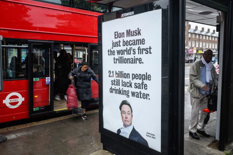 getty_6a2d085c35-1781336156 TOTTENHAM, ENGLAND - JUNE 11: An unofficially-installed poster critical of Elon Musk's wealth is displayed on a bus shelter on June 11, 2026 in Tottenham, England. The 'Everyone Hates Elon' activist group have placed posters in North London ahead of the SpaceX IPO on Friday, where Elon Musk looks set to become the world's first trillionaire. (Photo by Leon Neal/Getty Images)