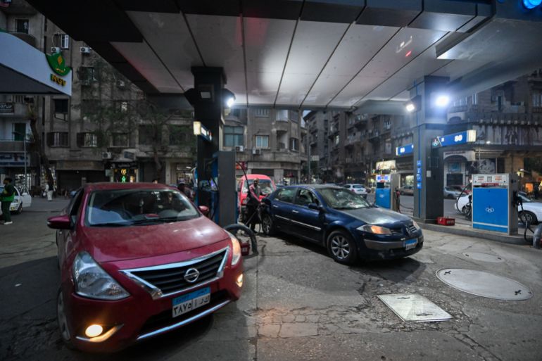 CAIRO, EGYPT - APRIL 1: Customers refuel vehicles at a gas station on April 1, 2026 in Cairo, Egypt. The Egyptian Prime Minister has confirmed that all commercial establishments such as malls, shops and cafes will close at 21:00, except Thursday and Friday, when they will close at 23:00, from today for a month to ration electricity consumption due to the shortage of petroleum products resulting from the ongoing war between US/Israel and Iran. (Photo by Sayed Hassan/Getty Images)