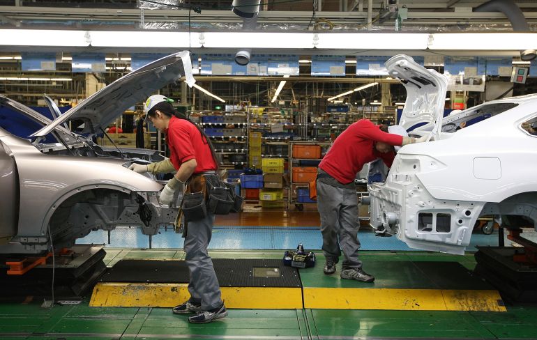 KAMINOKAWA, JAPAN - NOVEMBER 12: Workers assemble parts at Nissan's Tochigi Plant as Nissan announce the opening of the latest FUGA motor car production line on November 12, 2009 in Kaminokawa, Japan. Nissan's Tochigi plant produce models such as the Infiniti and the GT-R supercar as well the latest FUGA, which is a direct competitor to the Toyota Crown, Honda Legend and European executive class sedans. (Photo by Junko Kimura/Getty Images)