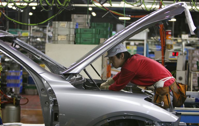 KAMINOKAWA, JAPAN - NOVEMBER 12: Workers assemble parts at Nissan's Tochigi Plant as Nissan announce the opening of the latest FUGA motor car production line on November 12, 2009 in Kaminokawa, Japan. Nissan's Tochigi plant produce models such as the Infiniti and the GT-R supercar as well the latest FUGA, which is a direct competitor to the Toyota Crown, Honda Legend and European executive class sedans. (Photo by Junko Kimura/Getty Images)