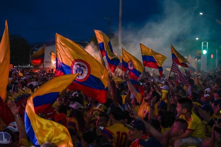 getty_6a3a971baf-1782224667 BARRANQUILLA, COLOMBIA - JUNE 21: Supporters of Abelardo de la Espriella, candidate for the Salvación Nacional, celebrate after the presidential elections during the 2026 presidential runoff in Colombia on June 21, 2026 in Barranquilla, Colombia. De la Espriella has 49.66% of the votes, while Ivan Cepeda, Presidential candidate for the Pacto Historico party, has 48.70% according to the quick count by the body responsible of the elections to chose the leader of the country from 2026 to 2030. (Photo by Leonardo Castañeda/Getty Images)
