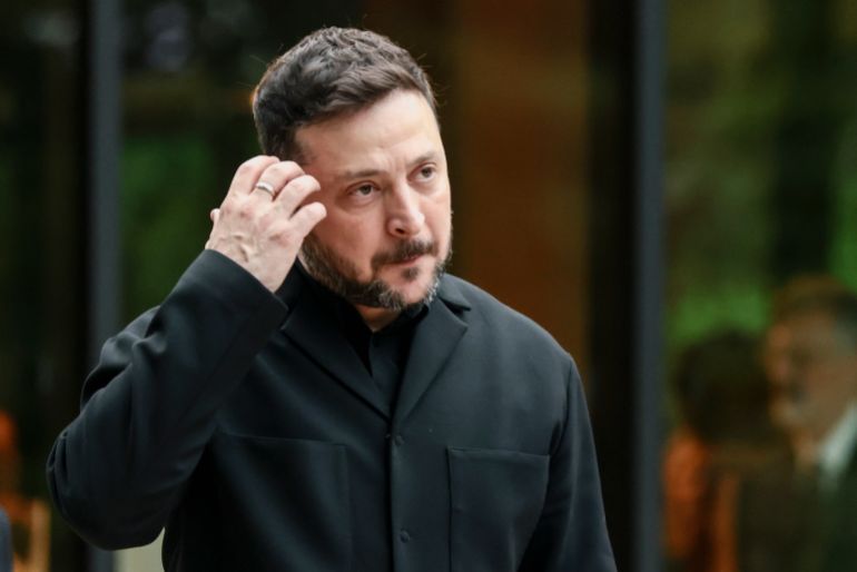 EVIAN-LES-BAINS, FRANCE - JUNE 16: Ukrainian President Volodymyr Zelensky prepares to pose for a family photo before a cultural performance and concert during the G7 Summit on June 16, 2026 in Evian-les-Bains, France. Leaders from the Group of 7 (G7) countries convened in Evian, France, near the Swiss border, for their annual summit to discuss challenges to peace and security for Ukraine and Europe, the situation in the Middle East, and other geopolitical issues. (Photo by Evelyn Hockstein-Pool/Getty Images)