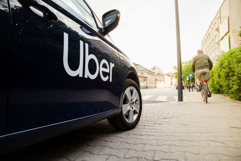 gettyimages-1311247904-1781280812 Warsaw, Poland - April 30, 2019: View on Uber car (Skoda) with inscription on the street before sunset