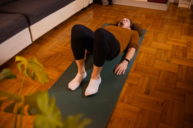 Young man performing an exercise knows as Kegel which strengthens your pelvic muscles