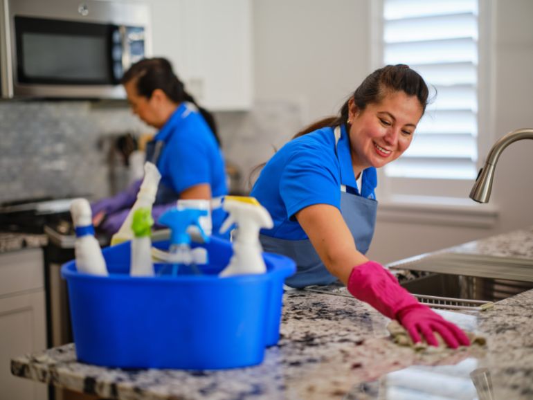 Professional housecleaning service at work in a home.