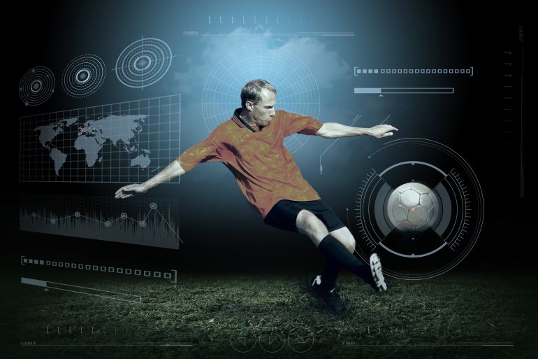 gettyimages-485747334-1779715581 Soccer player with ball in action outdoors