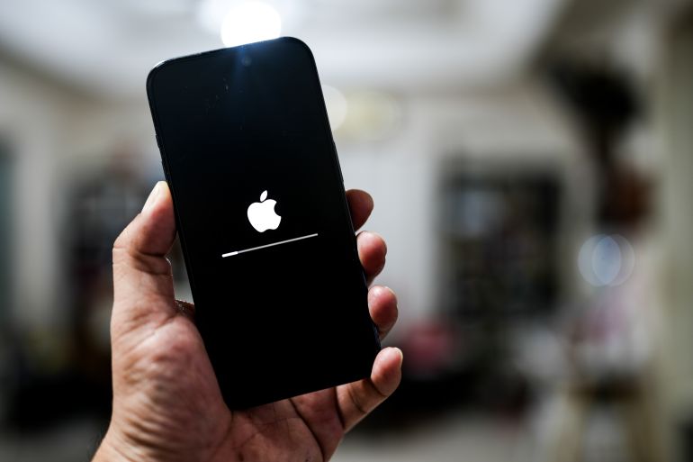 Bangkok, Thailand - October 29, 2024 : Software updating in apple iphone in hand, updated on phone