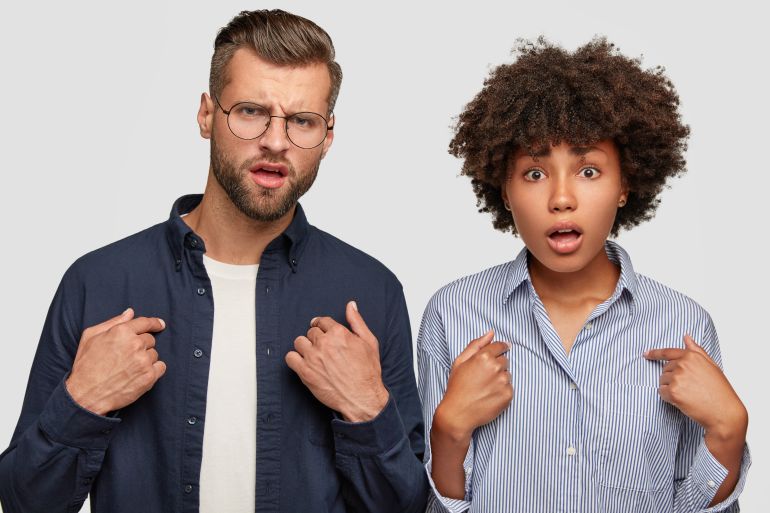 khlaf-mswwl-1777485916 Horizontal shot of indignant young female and male of different races, point at themselves, ask something, stand next to each other, being shocked and displeased. Why should we prepare this task?