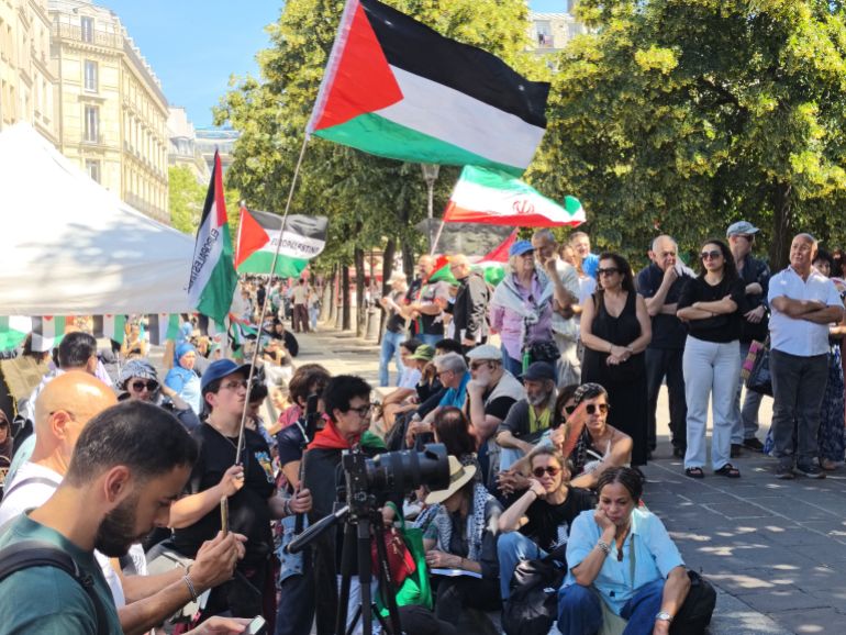 pic-885542-1781373701 PARIS, FRANCE - JUNE 13: Demonstrators wave Palestinian flags during a rally organized by EuroPalestine at the Fontaine des Innocents in Paris, France, on June 13, 2026. Awareness and document distribution stands were set up on site as participants denounced the war in Gaza and reaffirmed their support for the Palestinian people. ( Ümit Dönmez - Anadolu Agency )