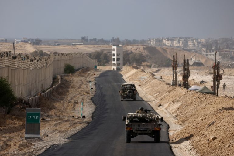 محور صلاح الدين Israeli military vehicles drive through the Philadelphi Corridor area in southern Gaza, amid the ongoing conflict between Israel and the Palestinian Islamist group Hamas in the Gaza Strip, September 13, 2024. REUTERS/Amir Cohen EDITOR'S NOTE: REUTERS PHOTOGRAPHS WERE REVIEWED BY THE IDF AS PART OF THE CONDITIONS OF THE EMBED. NO PHOTOS WERE REMOVED. TPX IMAGES OF THE DAY