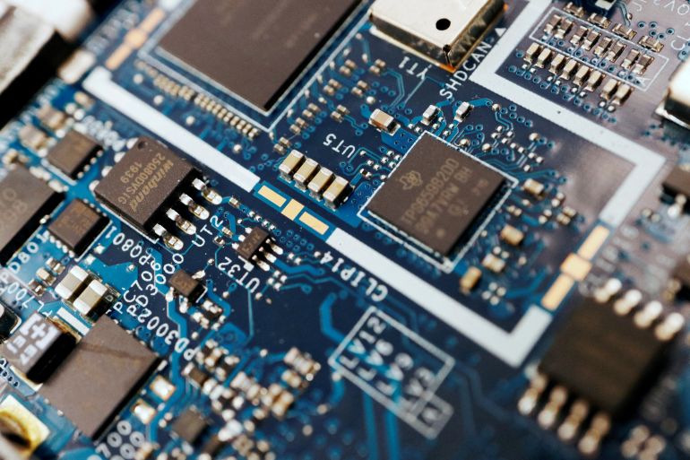 reuters_696fb52a-1768928554 FILE PHOTO: Semiconductor chips are seen on a circuit board of a computer in this illustration picture taken February 25, 2022. REUTERS/Florence Lo/Illustration/File Photo