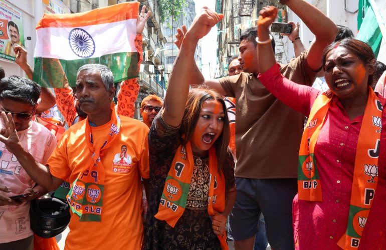 India's ruling Bharatiya Janata Party (BJP) supporters celebrate as early trends show their party leading in the West Bengal state assembly election results, outside the party's regional office in Kolkata, India, May 4, 2026. REUTERS/Sahiba Chawdhary