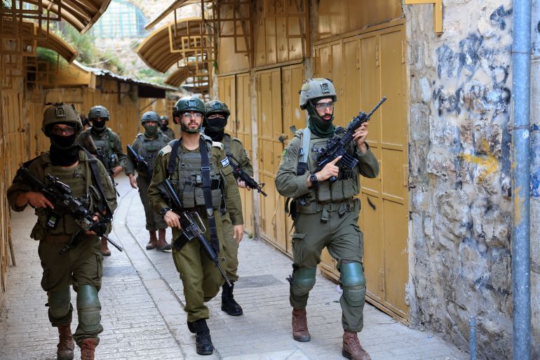 reuters_6a0434c2-1778660546 Israeli soldiers patrol during a weekly settlers' tour in Hebron, in the Israeli-occupied West Bank, May 9, 2026. REUTERS/Mussa Qawasma