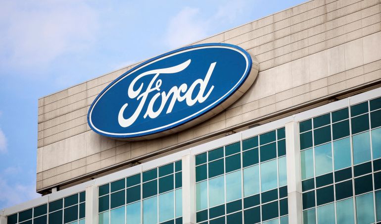 reuters_6a05f7bc-1778775996 FILE PHOTO: A Ford logo is seen on the Ford Motor World headquarters in Dearborn, Michigan, U.S., March 12, 2025. REUTERS/Rebecca Cook/File Photo