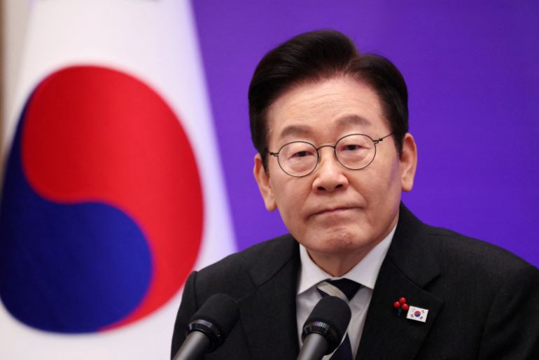 reuters_6a0ae092-1779097746 FILE PHOTO: South Korean President Lee Jae Myung listens to a reporter’s question during a press conference to mark the first anniversary of the December 3, 2024, martial law declaration by former President Yoon Suk Yeol, at the Blue House in Seoul, South Korea, December 3, 2025. REUTERS/Kim Hong-Ji/File Photo