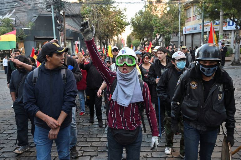 reuters_6a0e992a-1779341611 Demonstrators take part in a march, which organizers have dubbed a "defense of democracy," to rally against road blockades and what they call pressure measures used by protesters calling for the resignation of Bolivia’s President Rodrigo Paz, amid the country’s economic and fuel crisis, in La Paz, Bolivia, May 20, 2026. REUTERS/Claudia Morales REFILE - REWRITING FOR CLARITY AND ADDING ATTRIBUTION