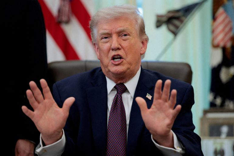 FILE PHOTO: U.S. President Donald Trump speaks during the signing ceremony for an executive order on mail ballots, in the Oval Office of the White House in Washington, D.C., March 31, 2026. REUTERS/Evan Vucci/File Photo