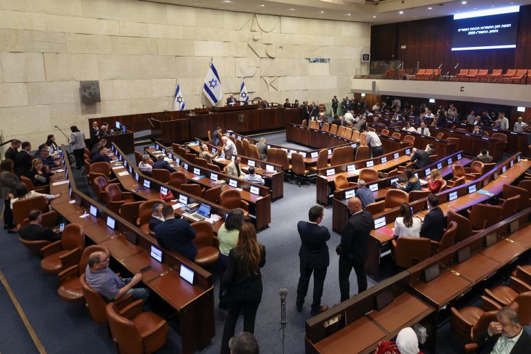 Israeli politicians react following a vote to dissolve the Knesset, Israel's parliament, before the end of its term, at the Knesset, in Jerusalem, May 20, 2026. REUTERS/Ronen Zvulun